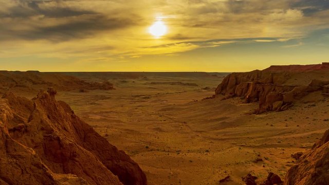 Bayanzag flaming cliffs at sunset in Mongolia, found in the Gobi Desert, zoom in timelapse 4k