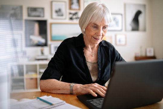 Senior businesswoman working at laptop