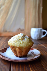 Home made muffin with a cup of cofee for breakfast.