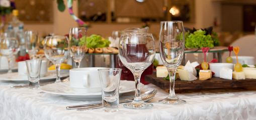 Served table in a restaurant. Glasses, wineglasses ...