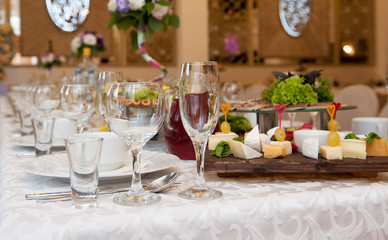 Served table in a restaurant. Glasses, wineglasses ...
