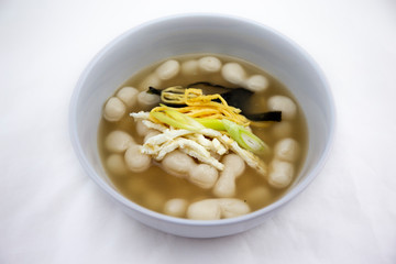 Korean style rice cake soup which is called Jolaeng-i Ddukkuk eats on the Lunar moon new year