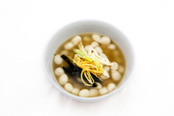 Korean style rice cake soup which is called Jolaeng-i Ddukkuk eats on the Lunar moon new year