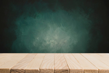 Heavenly blue wall and empty turquoise table.