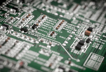 board with electronic components on white background