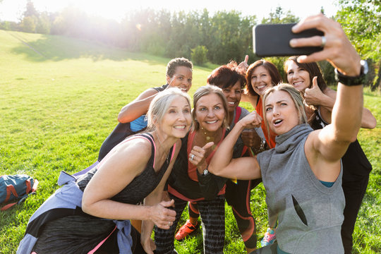 Group of women taking selfie on smart phone after bootcamp
