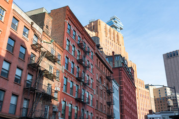 Fototapeta na wymiar Colorful Old Buildings with Fire Escapes in Tribeca New York