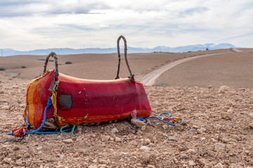 Colorful camel saddle on Agafay dessert, Morocco