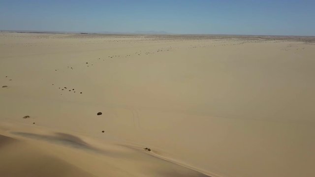 These dunes filmed in the Namib Desert outside Swakopmund, Namibia on a  DJI Mavic Pro at 4K 29.97fps. Near the Skeleton Coast, flying over the tops of dune creates a surreal, energizing experience.