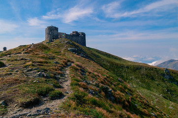 The old stone observatory stands on peak of the Carpathian Mountains