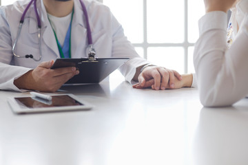 male doctor comforting patient who is in ambulance