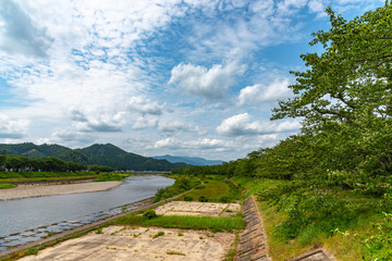 Hinokinai River riverbank in summer sunny day at Town Kakunodate, Semboku District, Akita Prefecture, Japan