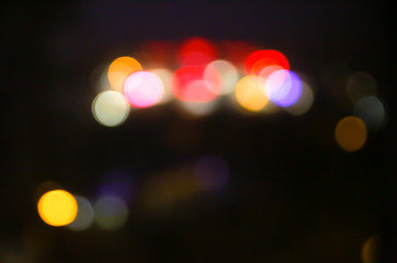 Blurred night city lights photo. Abstract pattern background in bokeh effect.
