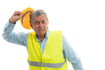 Builder preparing to throw helmet