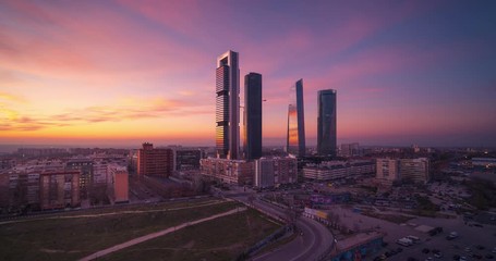 Day to night panoramic time lapse Madrid city skyscrapers. Beautiful sunset Four Towers business area.