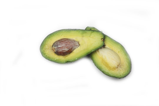 cut avocado isolated on white background. Horizontal image. Flat lay