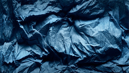 Navy blue paper background. Folded