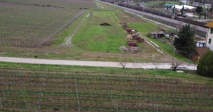 Cantoniera farmhouse vineyard aerial view above rows of vine crop growth. Frescobaldi vineyard Chianti wine area. Arno river valley near Florence. Pontassieve, Tuscany. Italy