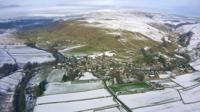 An aerial shot of Kettlewell, covered in a light dusting of snow