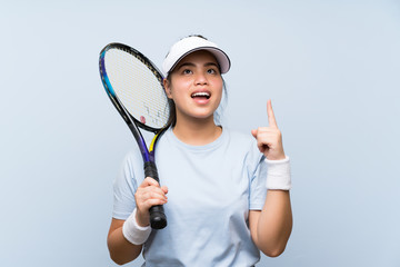 Young teenager Asian girl playing tennis intending to realizes the solution while lifting a finger up