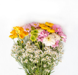 A bouquet of white cutter flowers and many colorful flowers on white background. Top view.