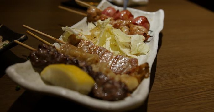 Yakitori is a Japanese type of skewered chicken. Its preparation involves skewering the meat with kushi a type of skewer.  the meat is typically seasoned with tare sauce or salt