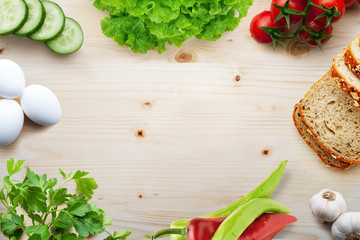 Various vegetables on a Wooden background.