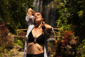 Woman near Labuhan Kebo Waterfall located in Munduk, Bali