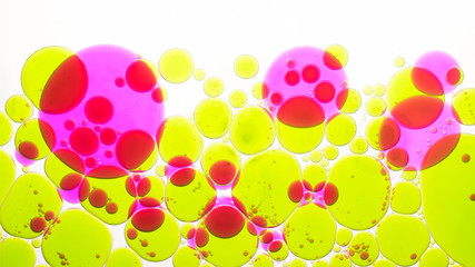 Abstract  macro view of colored oil drops in water