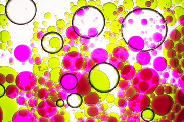 Abstract  macro view of colored oil drops in water