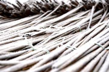 fragment of a reed roof  with hoarfrost, frosty morning. Floral background. Floral texture. 