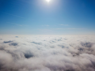 Aerial flight above clouds.