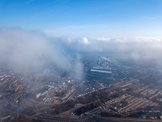 Aerial drone cityscape. Kiev city houses under rare clouds, top view.