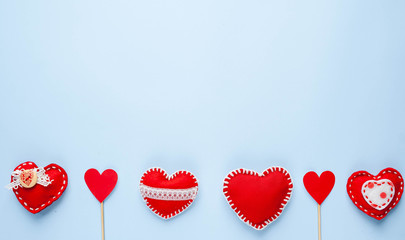 Valentine's day background. Various  hearts on a blue background. Valentine's day concept. Flat lay, top view, copy space.