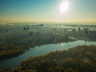 Aerial drone view. A view of the Dnieper River and the city of Kiev, shrouded in a light morning fog.