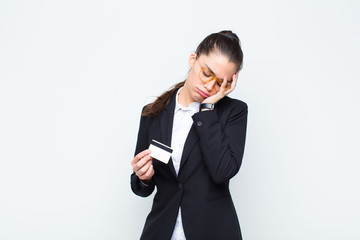 young businesswoman feeling bored, frustrated and sleepy after a tiresome, dull and tedious task,...