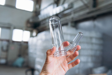 Preparations for plastic bottles on production on men's hands