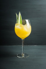 Pineapple cocktail in wine glass. Selective focus. Shallow depth of field.