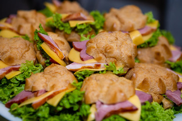 Sandwich with ham, lettuce and cheese.