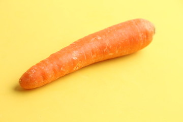 delicious carrot in color background