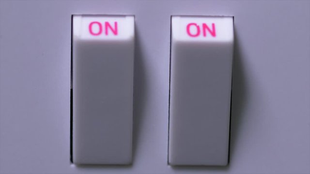 Extreme Close Up Of Hand Turning Plug Socket Switches On And Off. Uk Plug Socket. Power On And Off