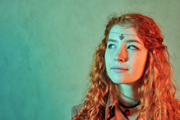 Red haired witch with head jewelry