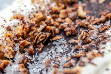 Ice cream with chocolate coating and peanut crumb