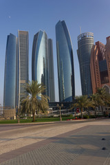 etihad towers modern skyscrapers in Abu Dhabi at sunset light