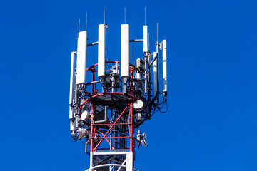 Top of telecommunication tower with antennas and transmitters