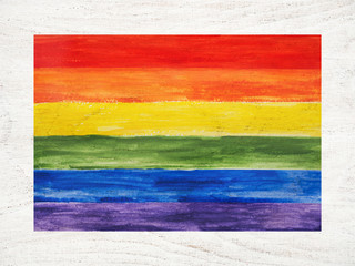 Beautiful postcard with a rainbow flag. Top view, close up