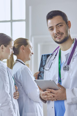 Team of doctors watching x-ray image in a hospital