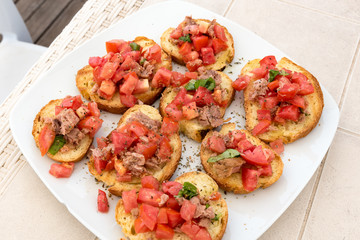 Appetizer of bruschetta with tuna