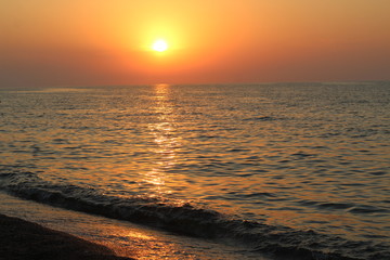 Beautiful sunset above the sea in summer