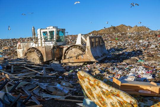 Bulldozer at garbage dump